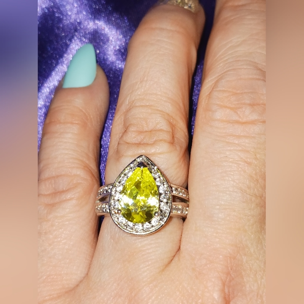 Sterling Silver Ring with Pear-Shaped Peridot Solitaire Surrounded by CZ Accents